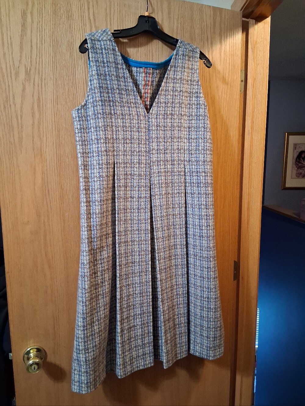 textured tweed or bouclé weave sleeveless dress, deep inverted front pleats